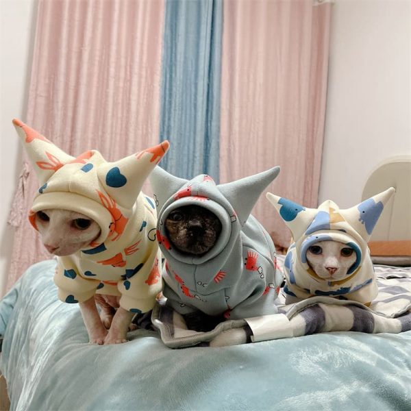 Hairless Cat Sweaters-Three cats wear sweaters